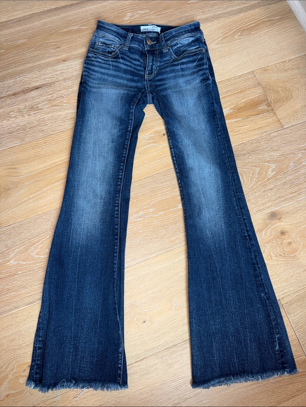 Buckle Women's Dark Indigo Flare Jeans with Raw Hem
